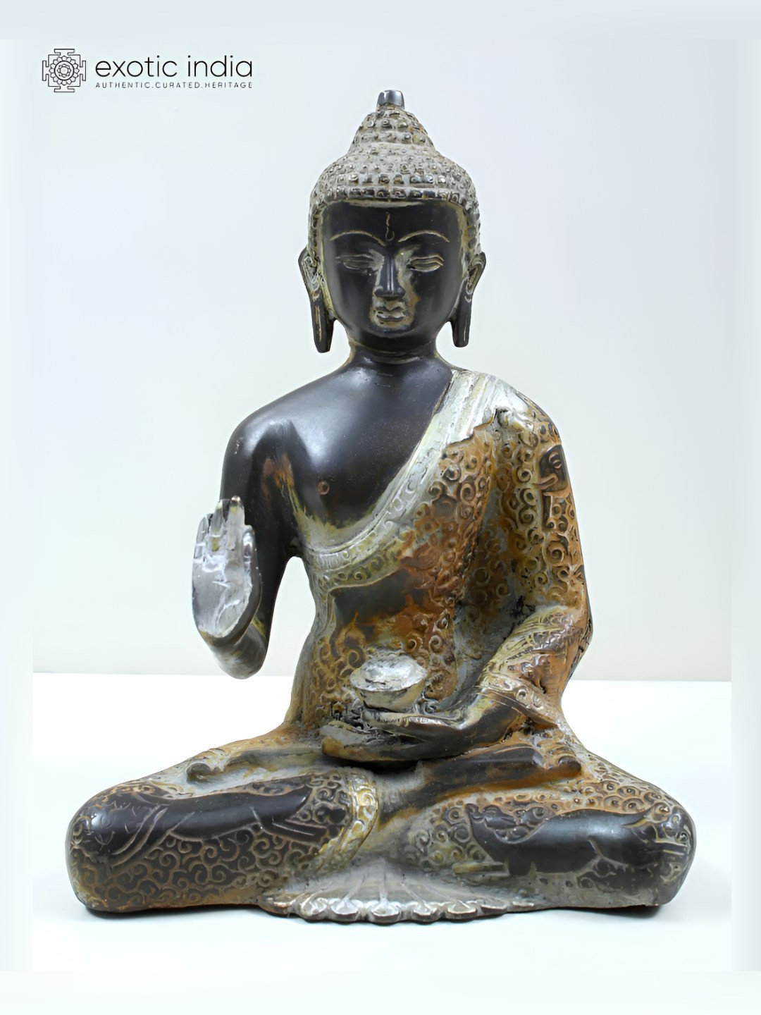 Exotic India Tibetan Buddhist Deity Blessing Buddha Silver Brass Metallic Living Room Small Showpiece - 8.3 Inches