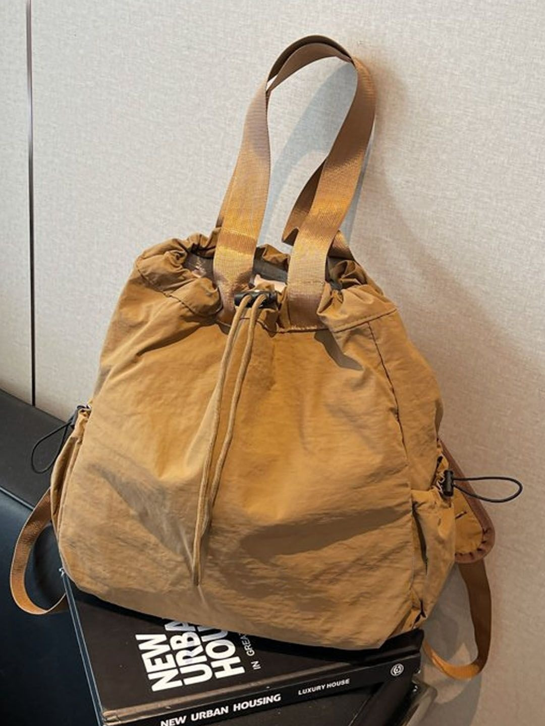 StyleCast PU Bucket Sling Bag with Tasselled