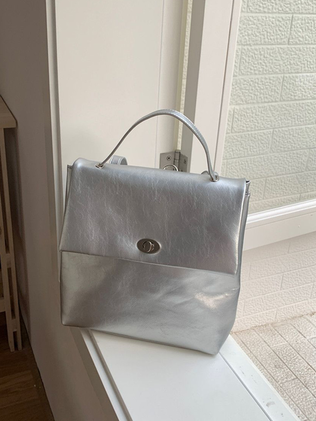 StyleCast Women Large Solid Magnetic Button Backpacks