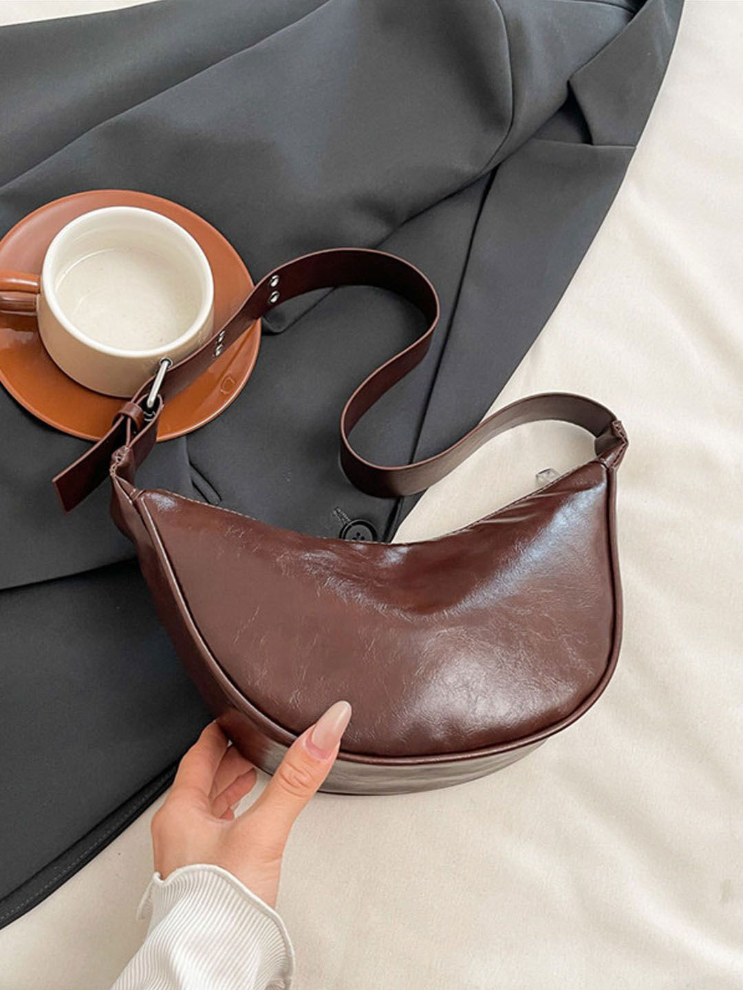 StyleCast Coffee Brown Textured Printed Half Moon Sling Bag