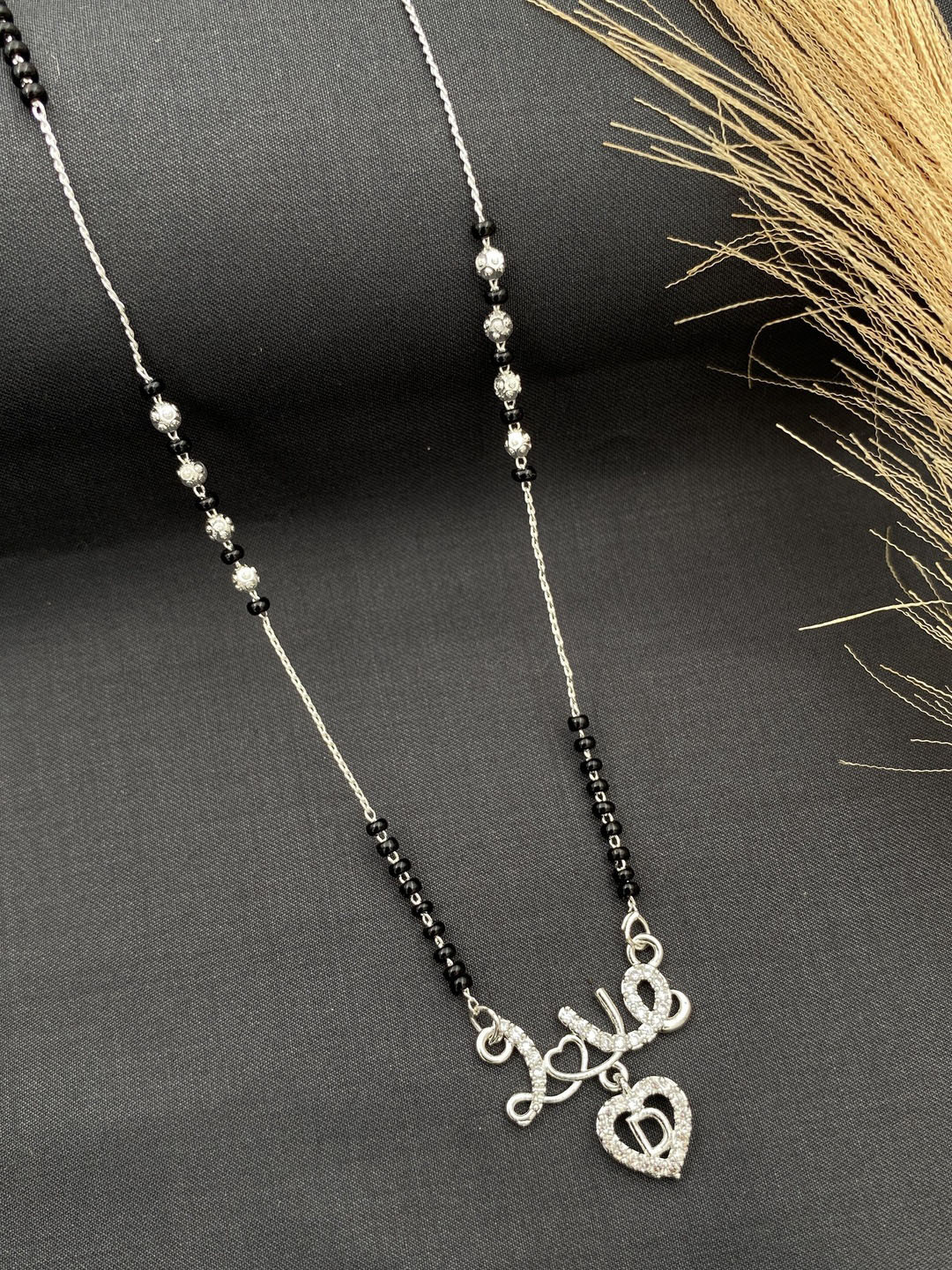 Laksh Enterprise Artificial Stones Studded & Beaded Heart Shaped D Alphabet Mangalsutra