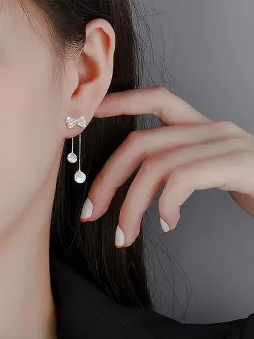 DressBerry Gold Plated Cubic Zirconia Studded Bow Shiny Tassels Spherical Drop Earrings