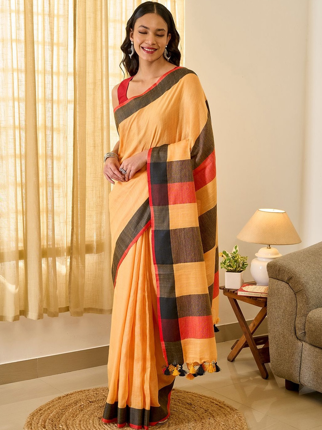 TEEJH Soothing Peach, Red and Black Block Saree