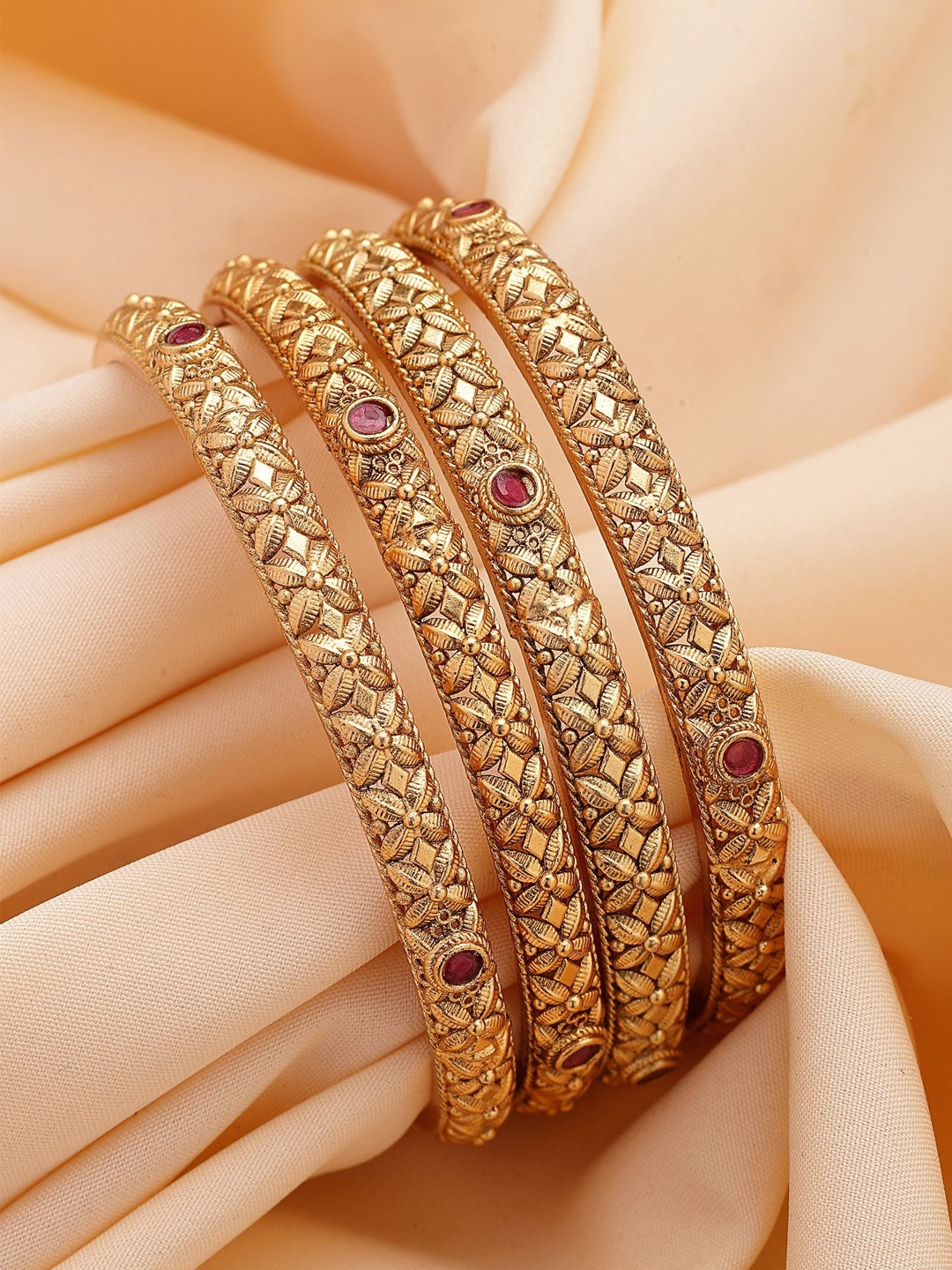 KARATCART Set Of 4 Gold-Plated Floral Design Stone-Studded Bangles