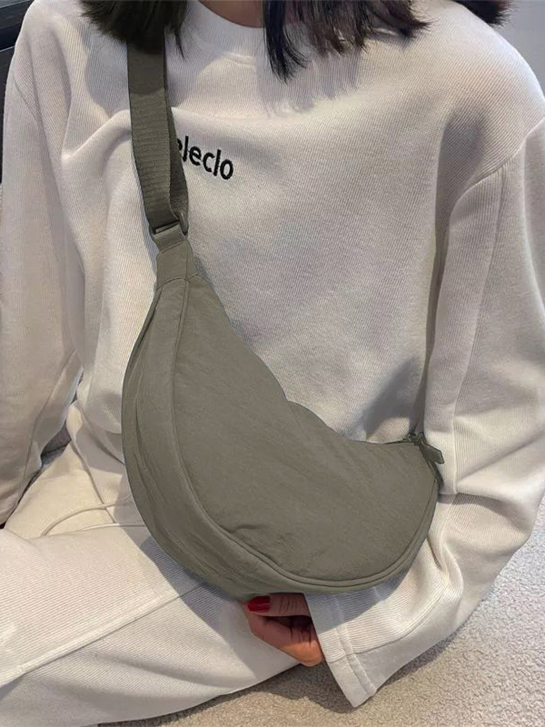 GLOSSY Half Moon Sling Bag with Tasselled