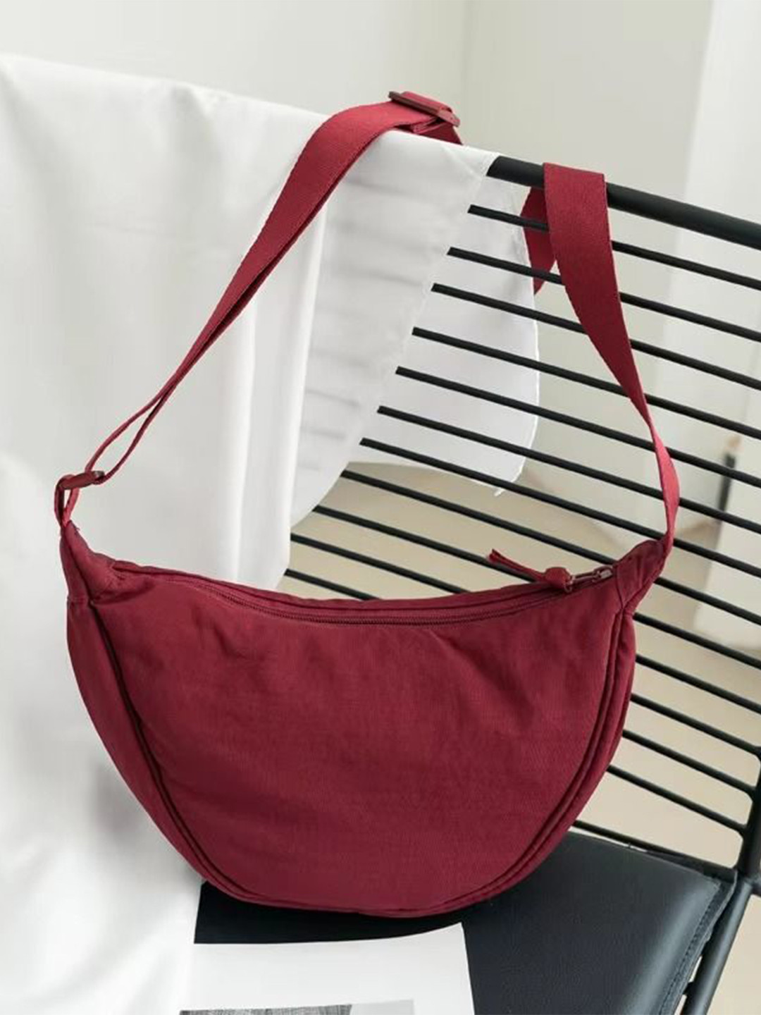 GLOSSY Half Moon Sling Bag with Tasselled