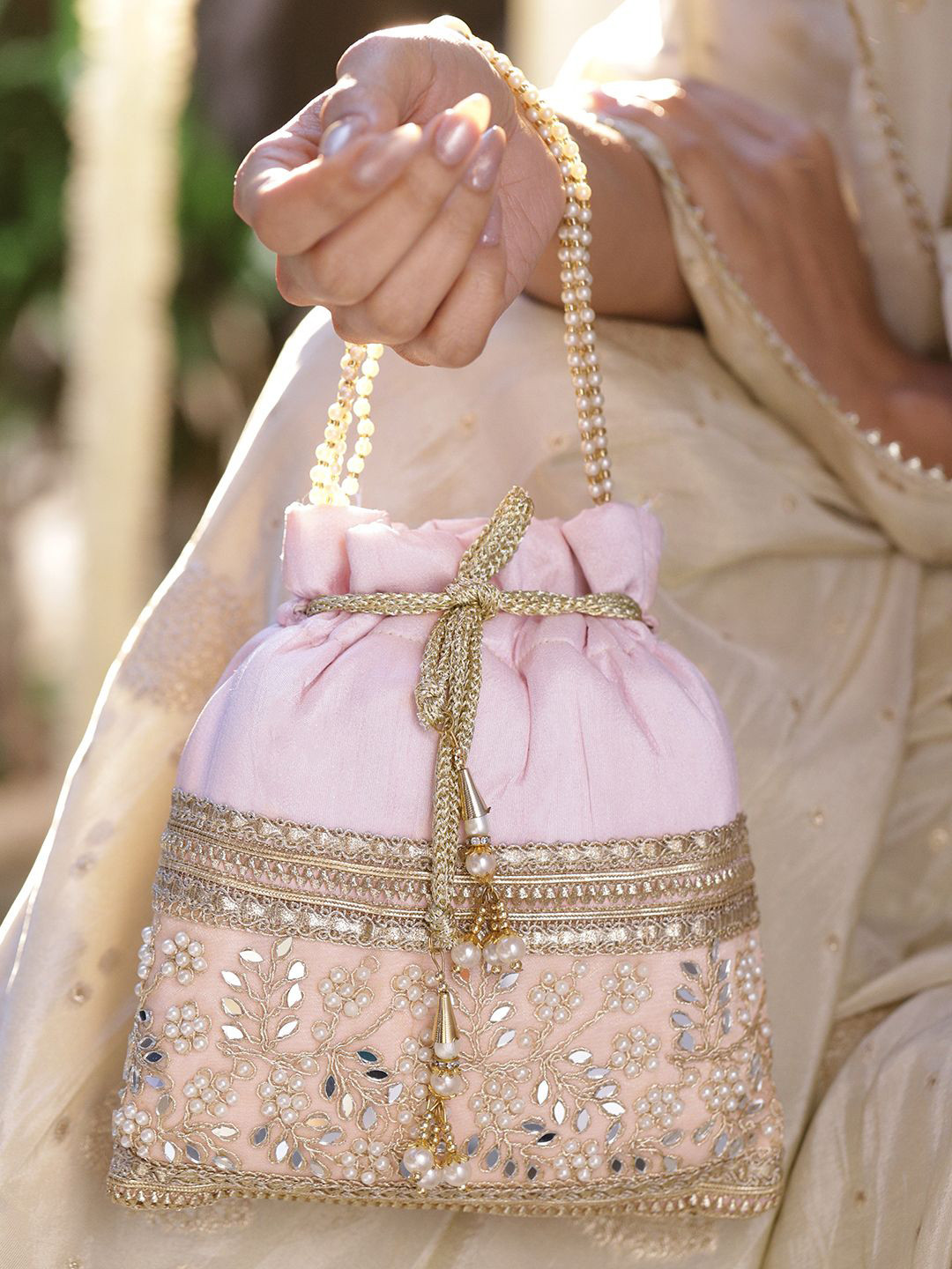 Rubans Pastel Pink Potli Bag with Golden Zari, Mirror & Floral Embroidery & Beaded Handle
