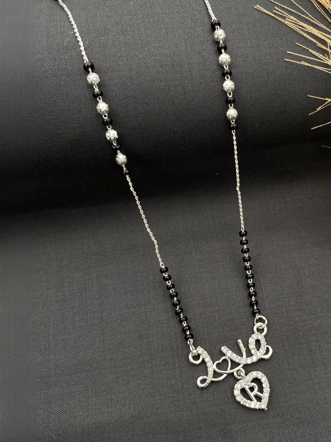 Laksh Enterprise Artificial Stones Studded & Beaded Heart Shaped R Alphabet Mangalsutra