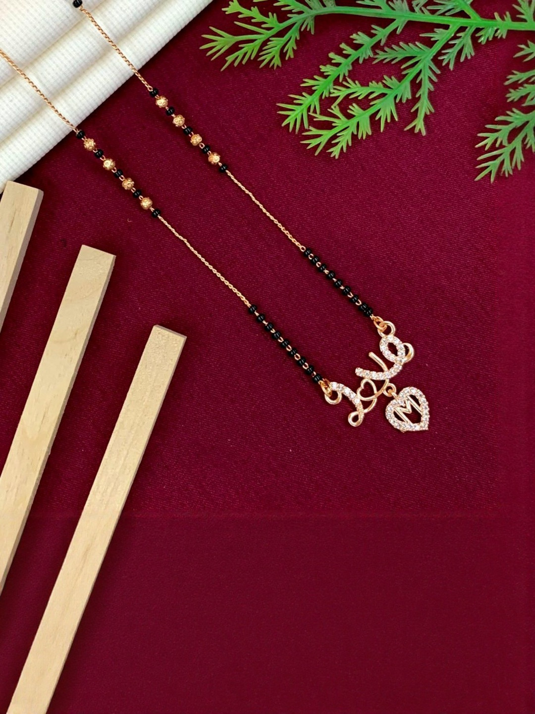 Laksh Enterprise Artificial Stones Studded & Beaded Heart Shaped M Alphabet Mangalsutra