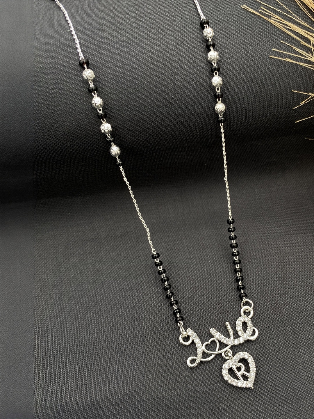 Laksh Enterprise Artificial Stones Studded & Beaded Heart Shaped R Alphabet Mangalsutra