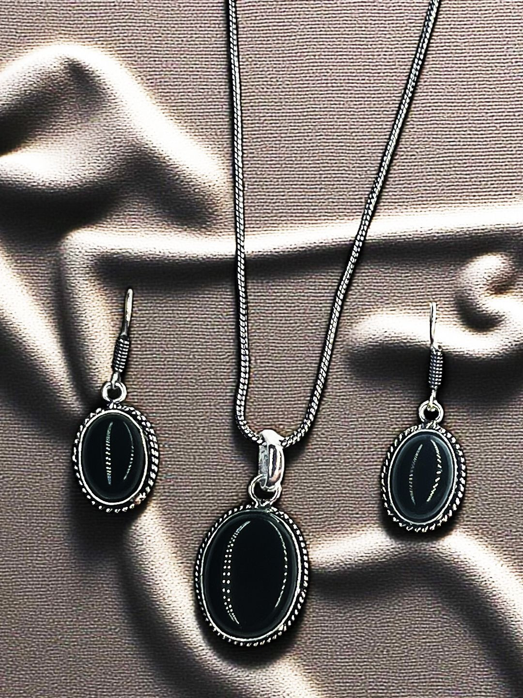 The Style Courtyard Artificial Stone-Studded Oxidised Oval Shaped Pendant And Earrings