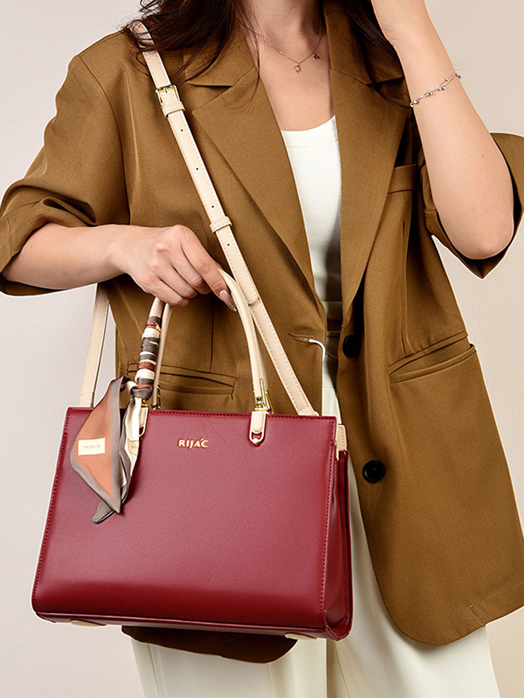 RIJAC Women Tovo Solid Structured Handheld Bag