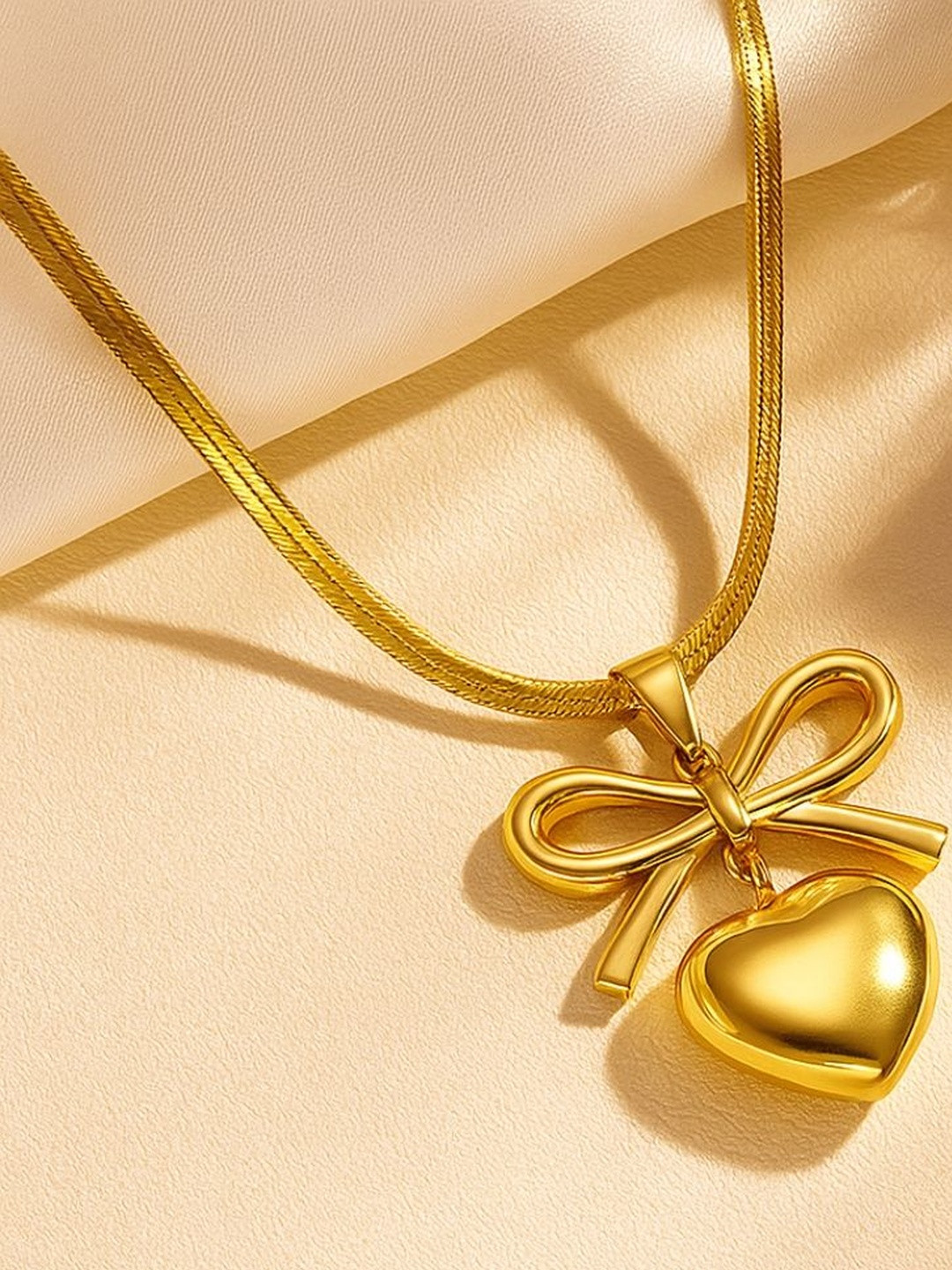 Bracotive Gold-Plated Anti Tarnish Bow With Heart Necklace