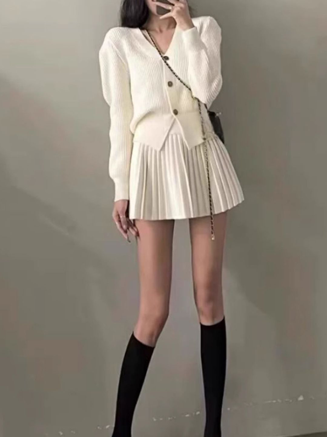 bebe Ribbed V-Neck Sweater With Pleated Mini Skirt