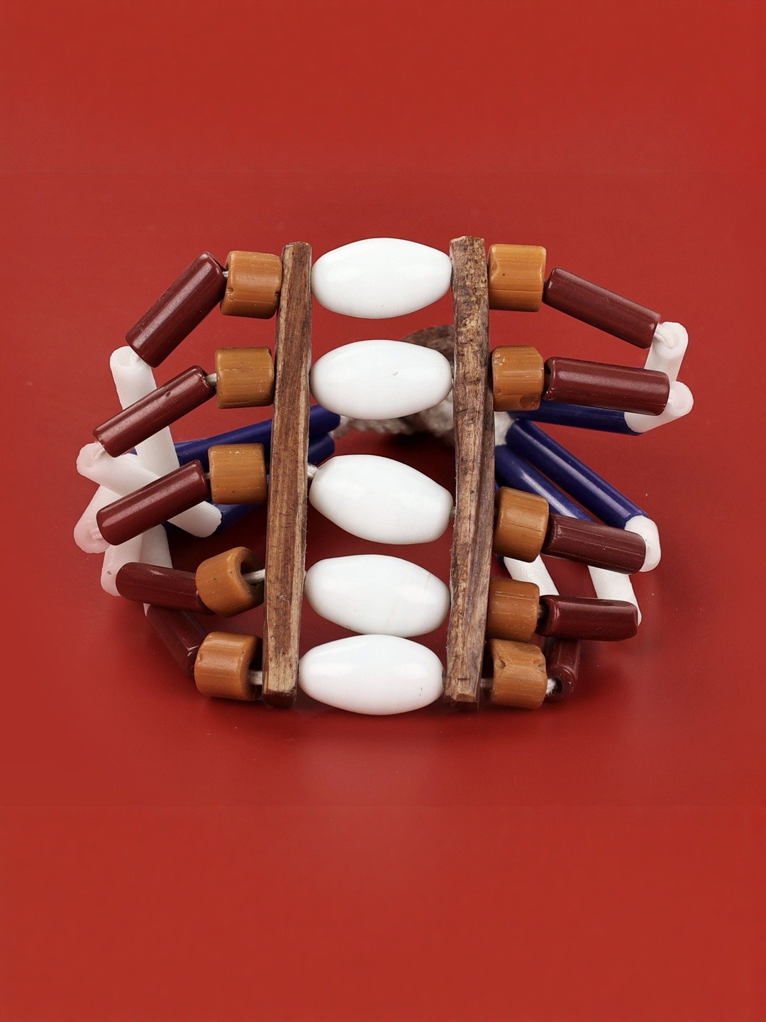 Exotic India Women Artificial Beaded Wooden Tribal Style Elasticated Bracelet