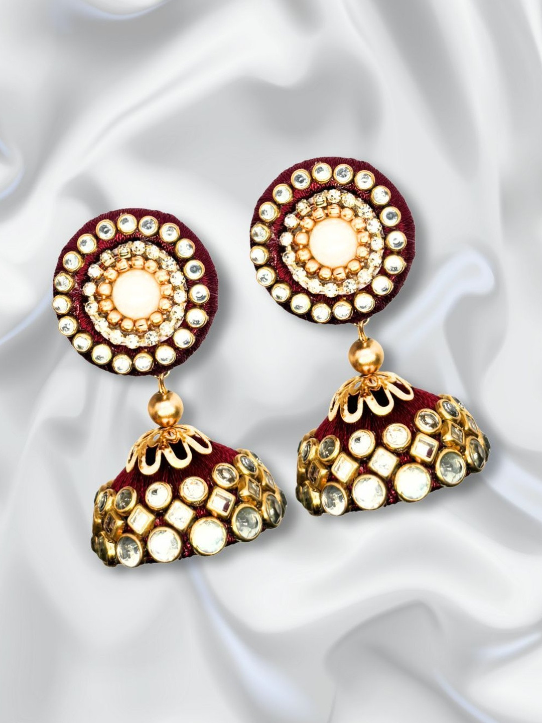 Saumakshi Designs  Plastic Kundan Studded Classic Jhumka Earrings