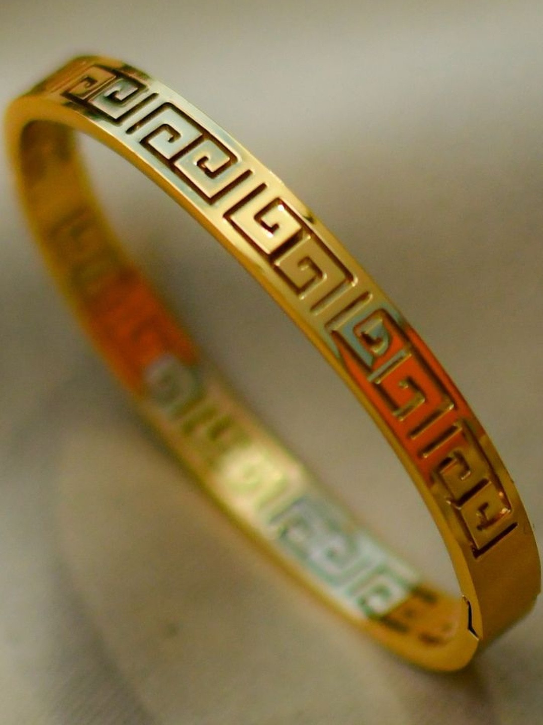 RaasRani Women Gold-Plated Swastik Engraved Cuff Bracelet