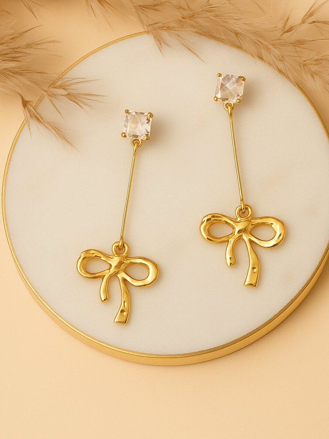 Haute Handles Stainless Steel Cubic Zirconia Studded Bow Shaped Drop Earrings