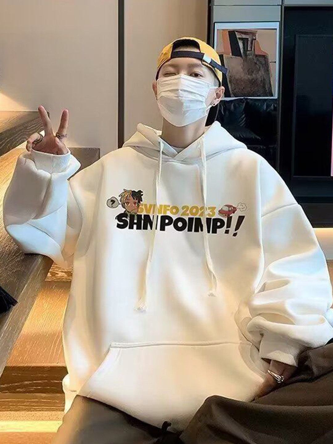 StyleCast x Revolte Comic Printed Hooded Sweatshirt