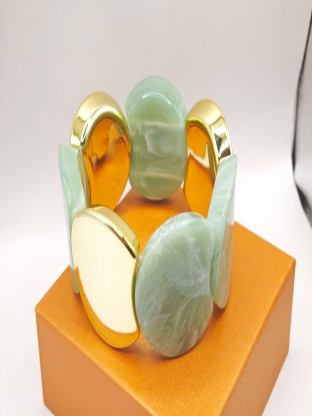 SAPRAA TRENDS Women Ceramic Resin Gold-Plated Cuff Bracelet