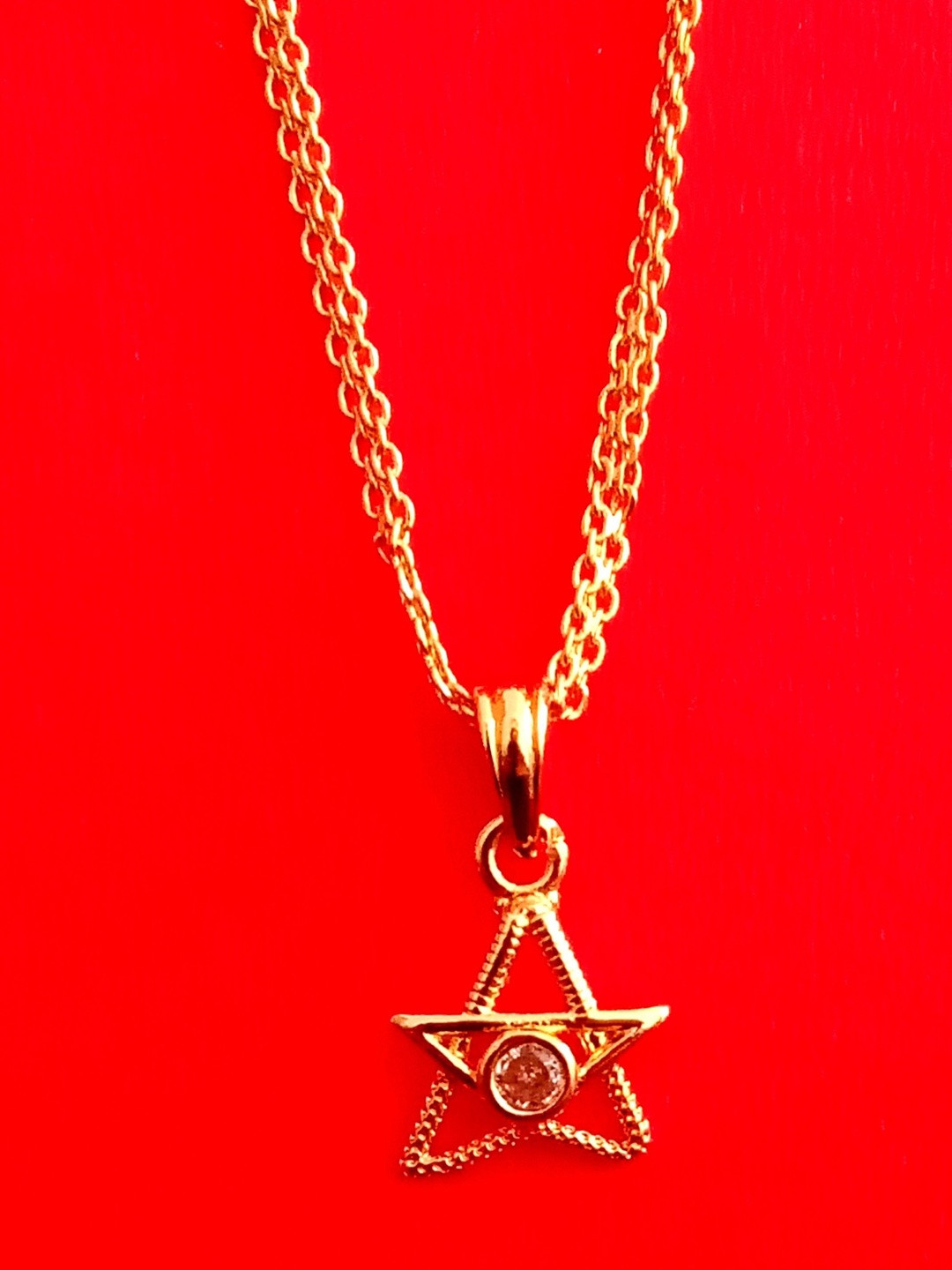 Nawab Collection Gold-Plated Artificial Stones Studded Star Shaped Pendant With Chain