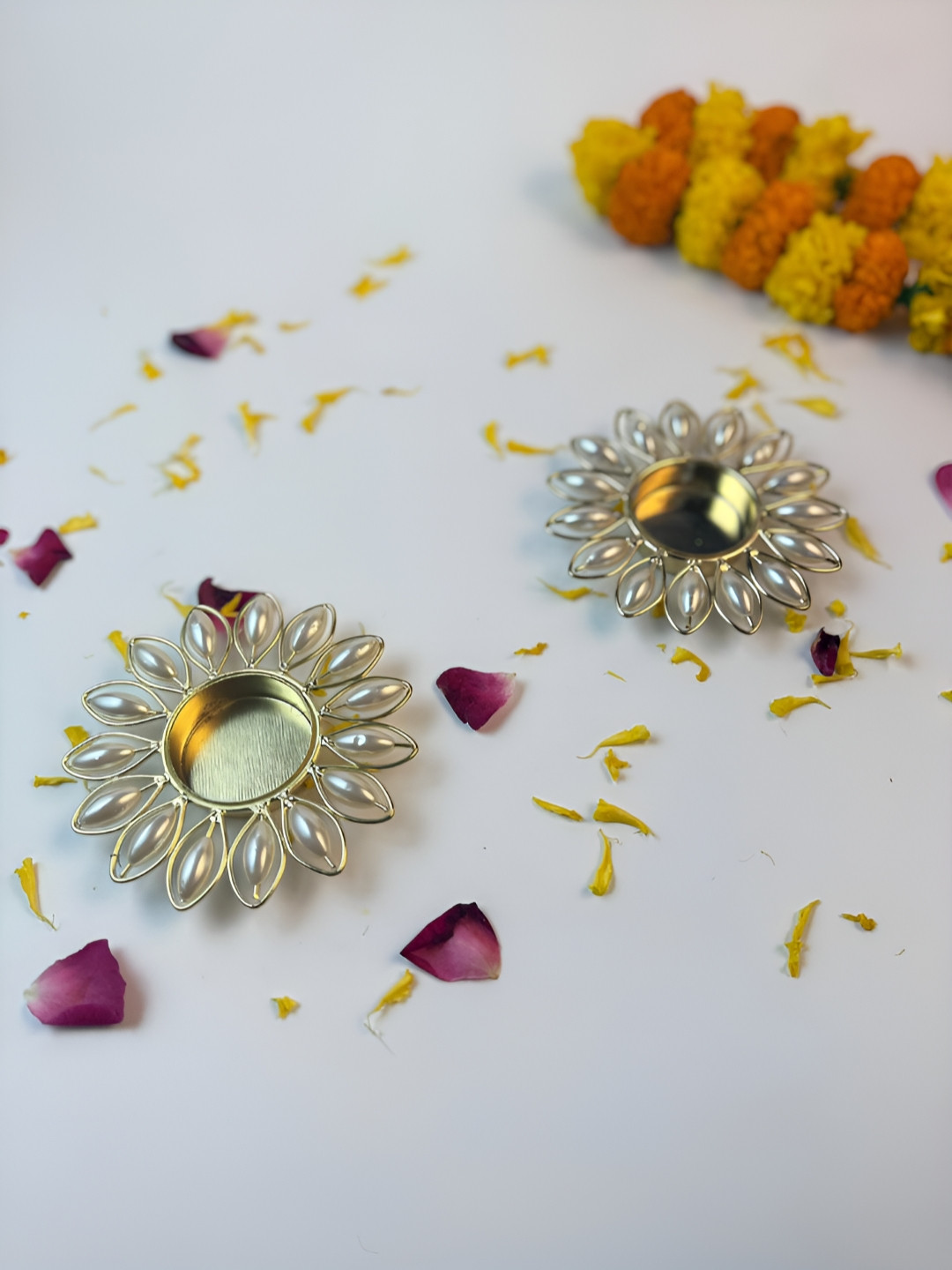 Giftii Gold Toned 2 Pieces Diya & Pearl Flower Embellished Tea-Light Candle Holders