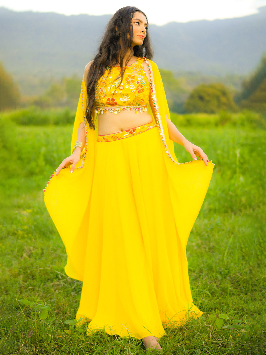LABEL KANUPRIYA Women Yellow Embroidered Poly Georgette Crop Top Sharara and Cape Set
