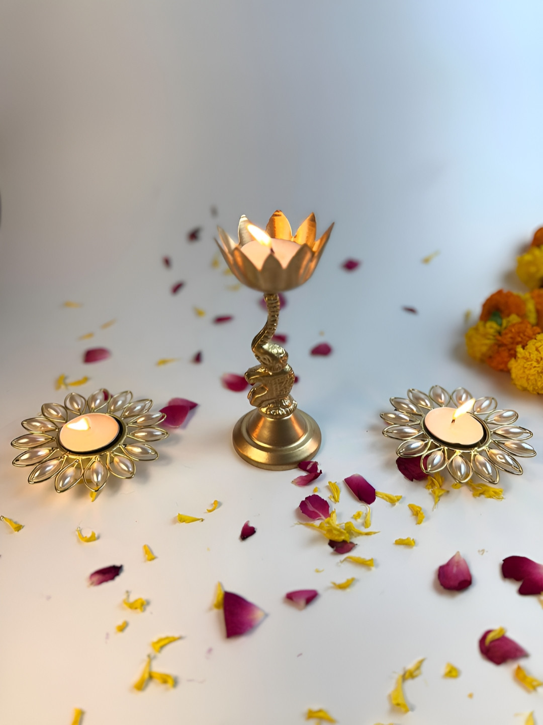 Giftii Gold Toned 3 Pieces Elephant & Lotus Embellished Metal Tea-Light Candle Holders