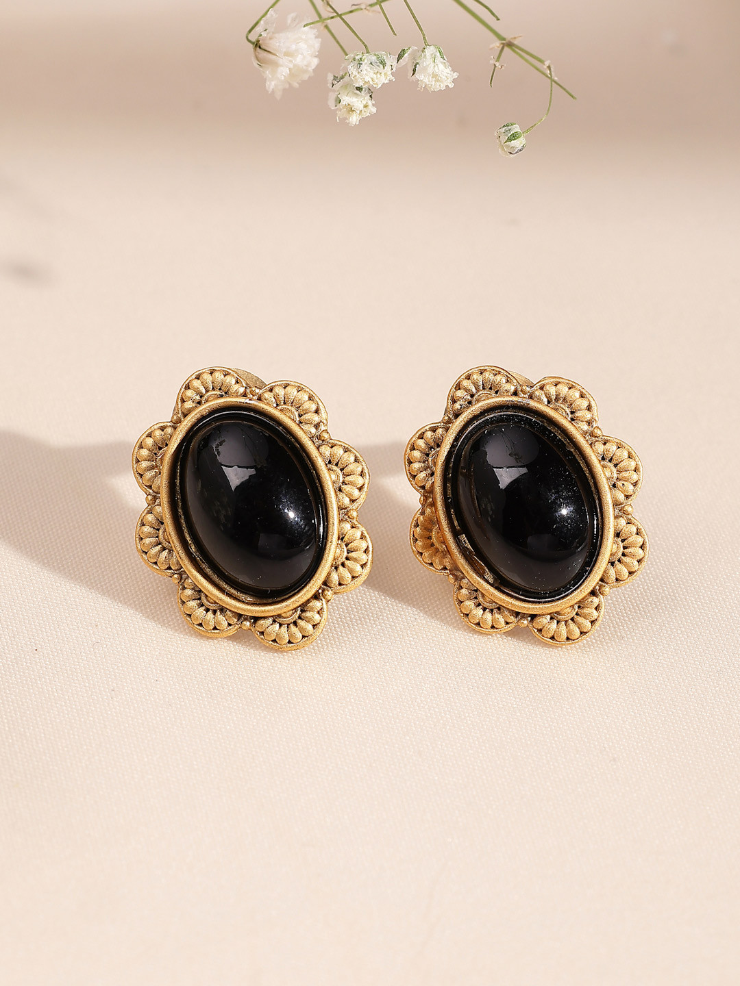 ADIVA Antique Gold-Plated Black Sapphire Stone Oval Stud Earrings with Textured Floral Design