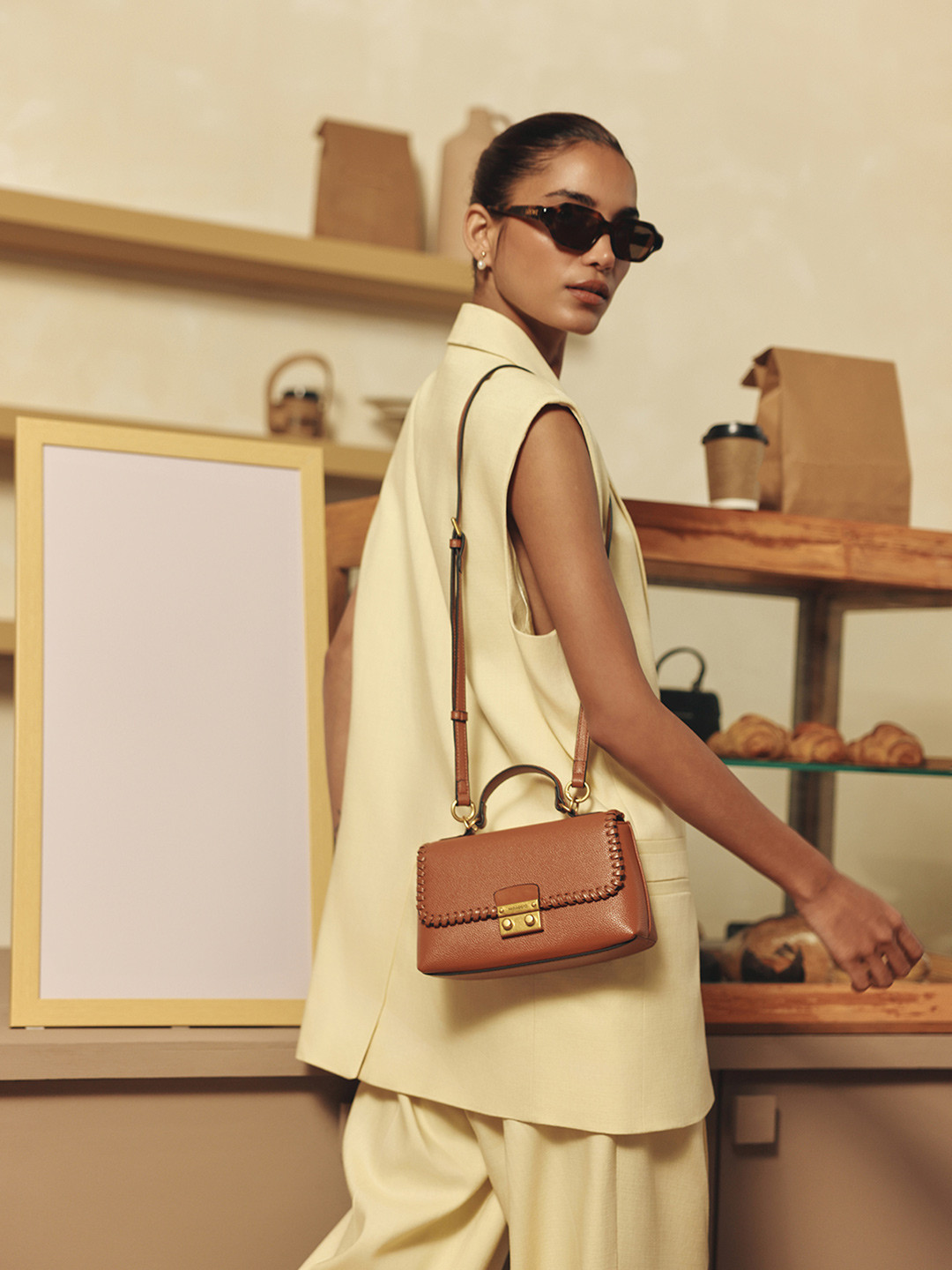 MIRAGGIO Textured Half Moon Sling Bag