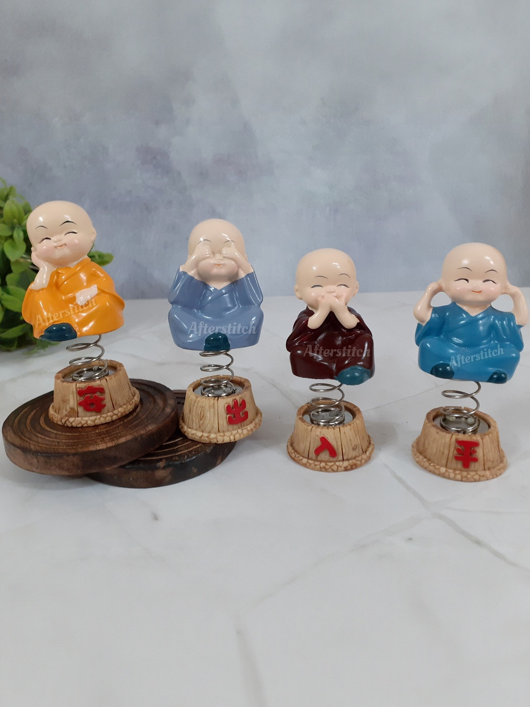 Afterstitch Set Of 4 Multicoloured Spring stand Bobble Head Baby Monk Showpieces
