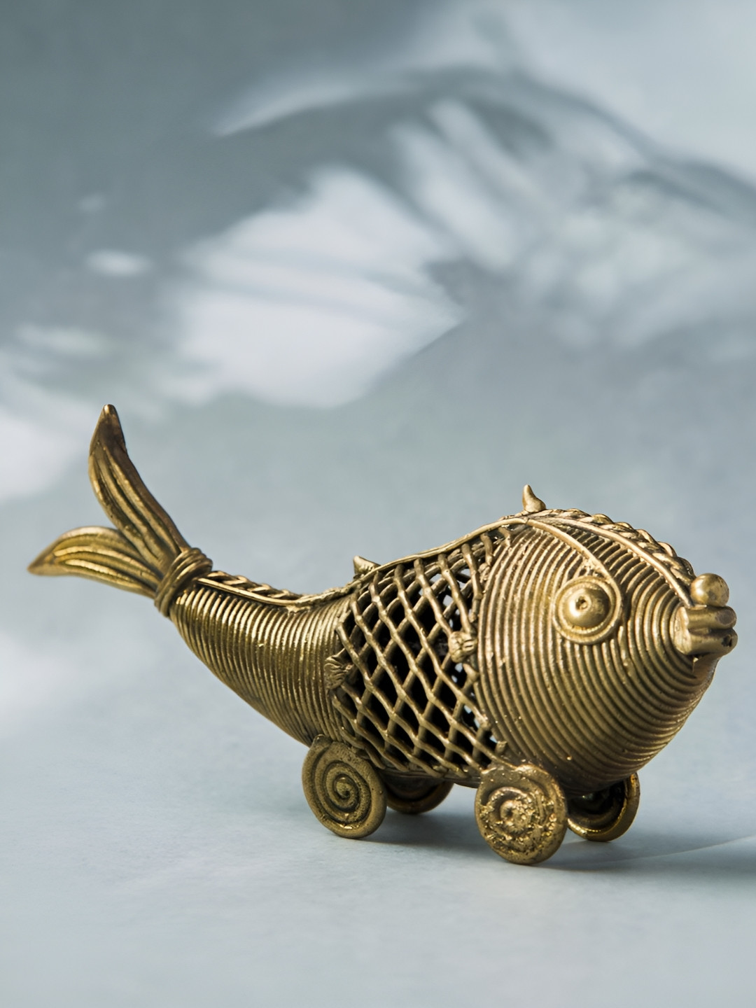 Fabindia Yatan Gold-Toned & Black Fish Brass Figurine Showpiece