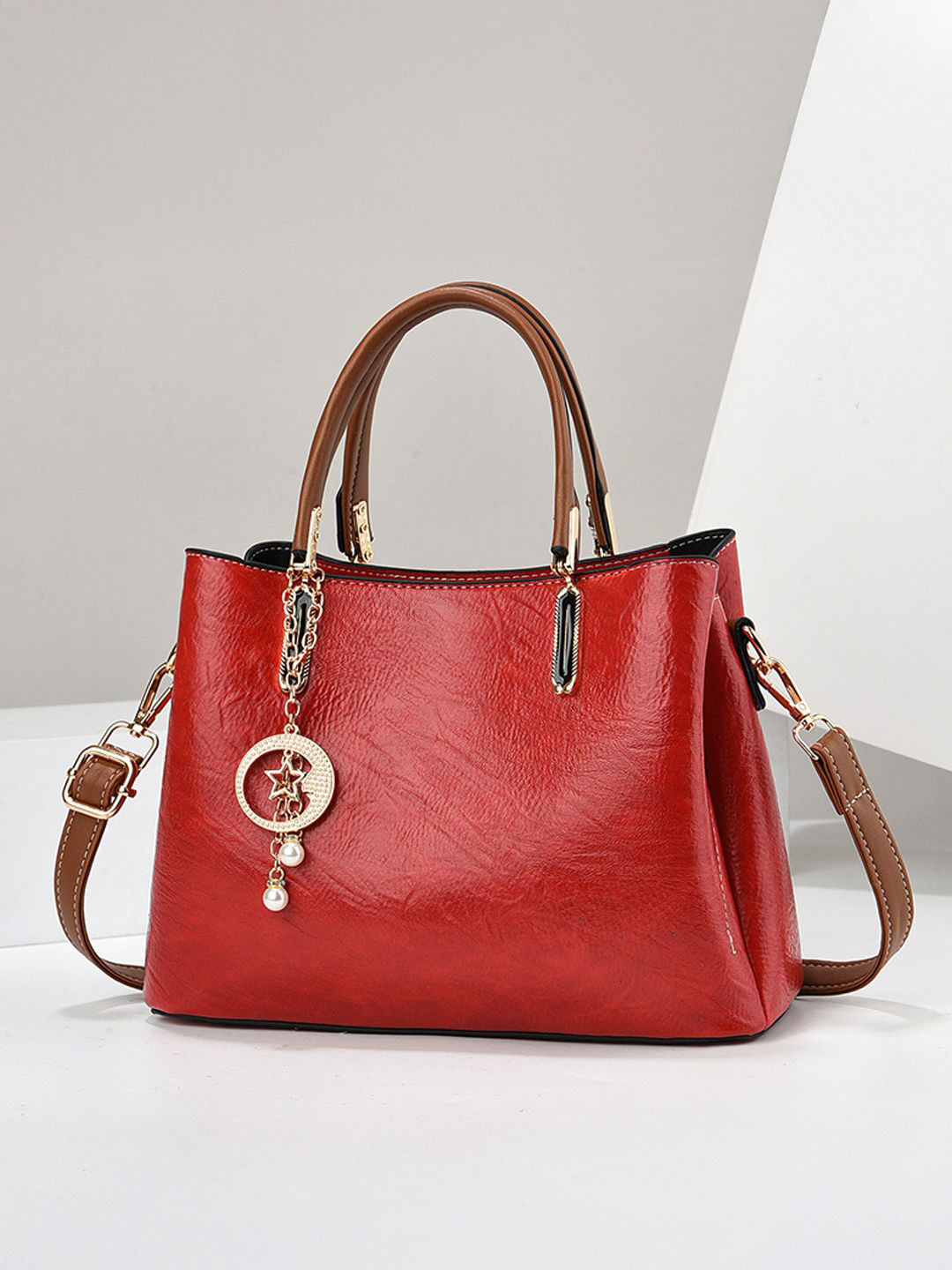 StyleCast Women Solid Structured Embellished Handheld Bag