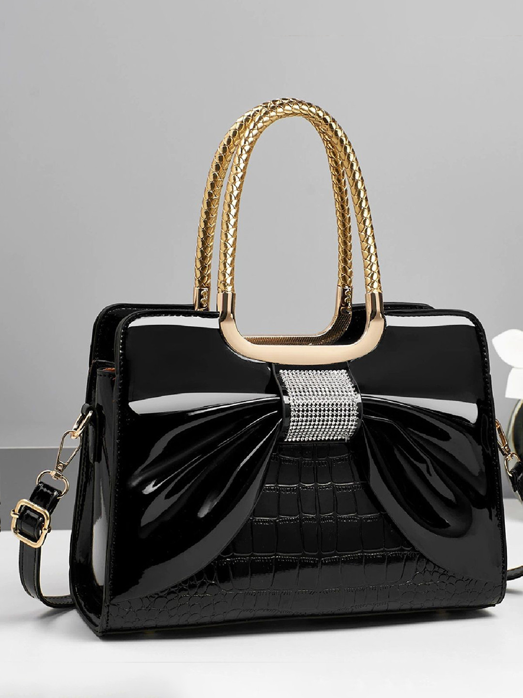 StyleCast Black & Gold Toned Structured Handheld Bag With Bow Detail