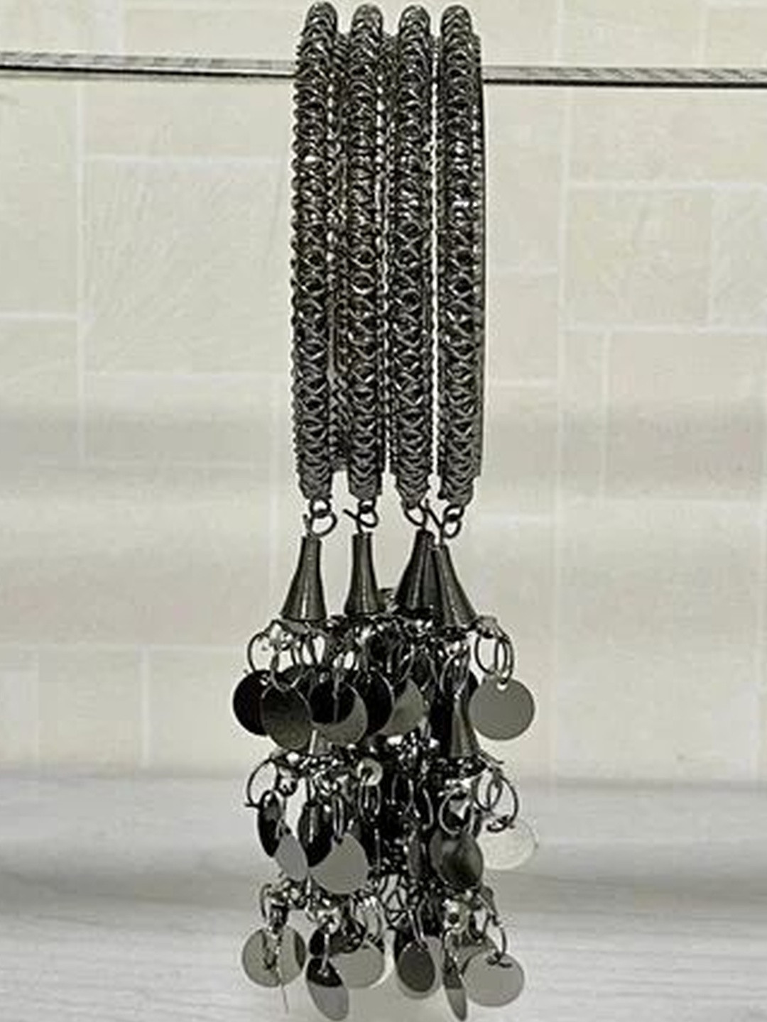 Shivarth Women Pack of 4 Alloy Latkan Coin Charm Hanging Black Tassel Bangles Set