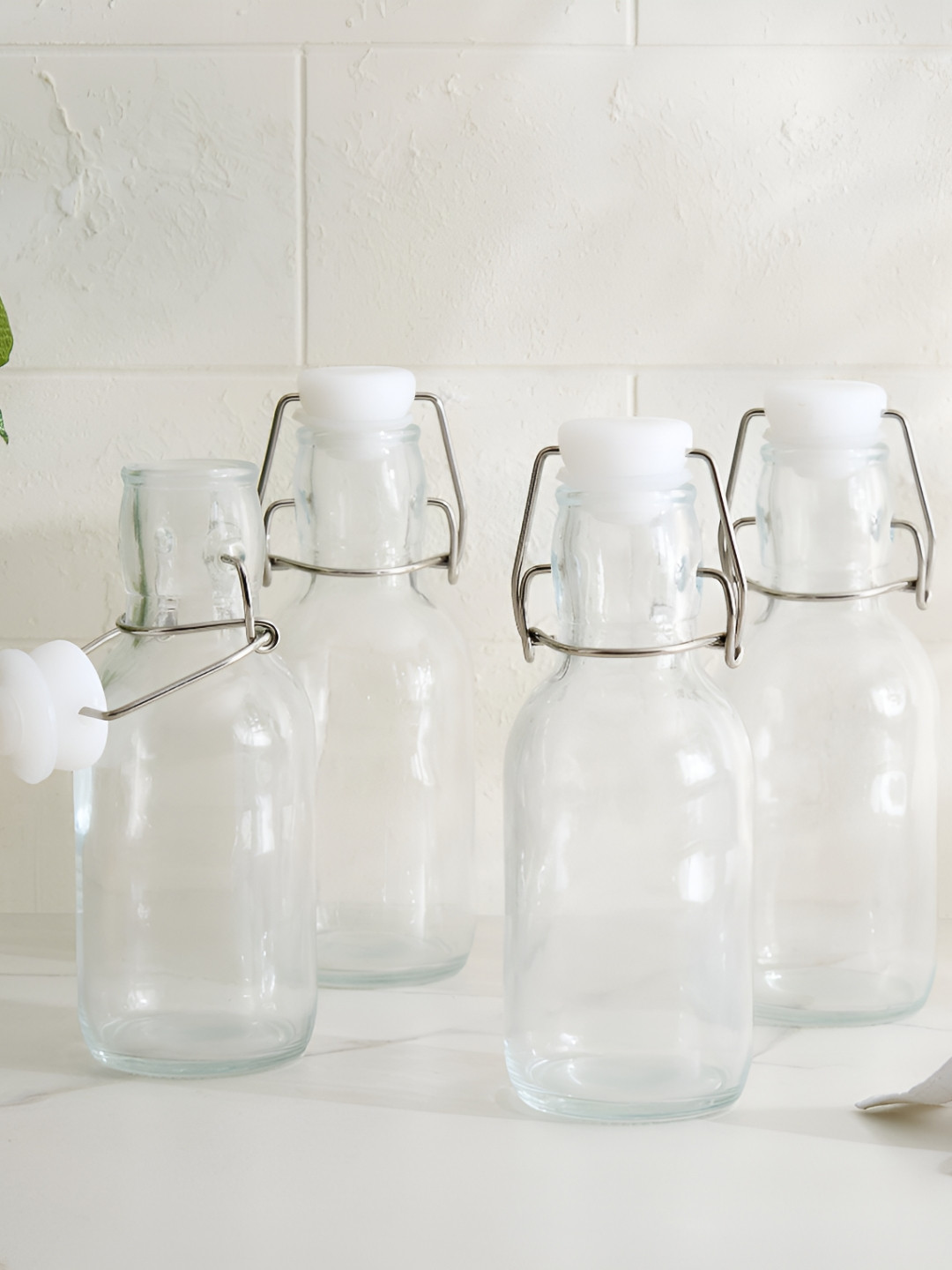 Home Centre Transparent 4 Pieces Glass Water Bottles 250 ml Each