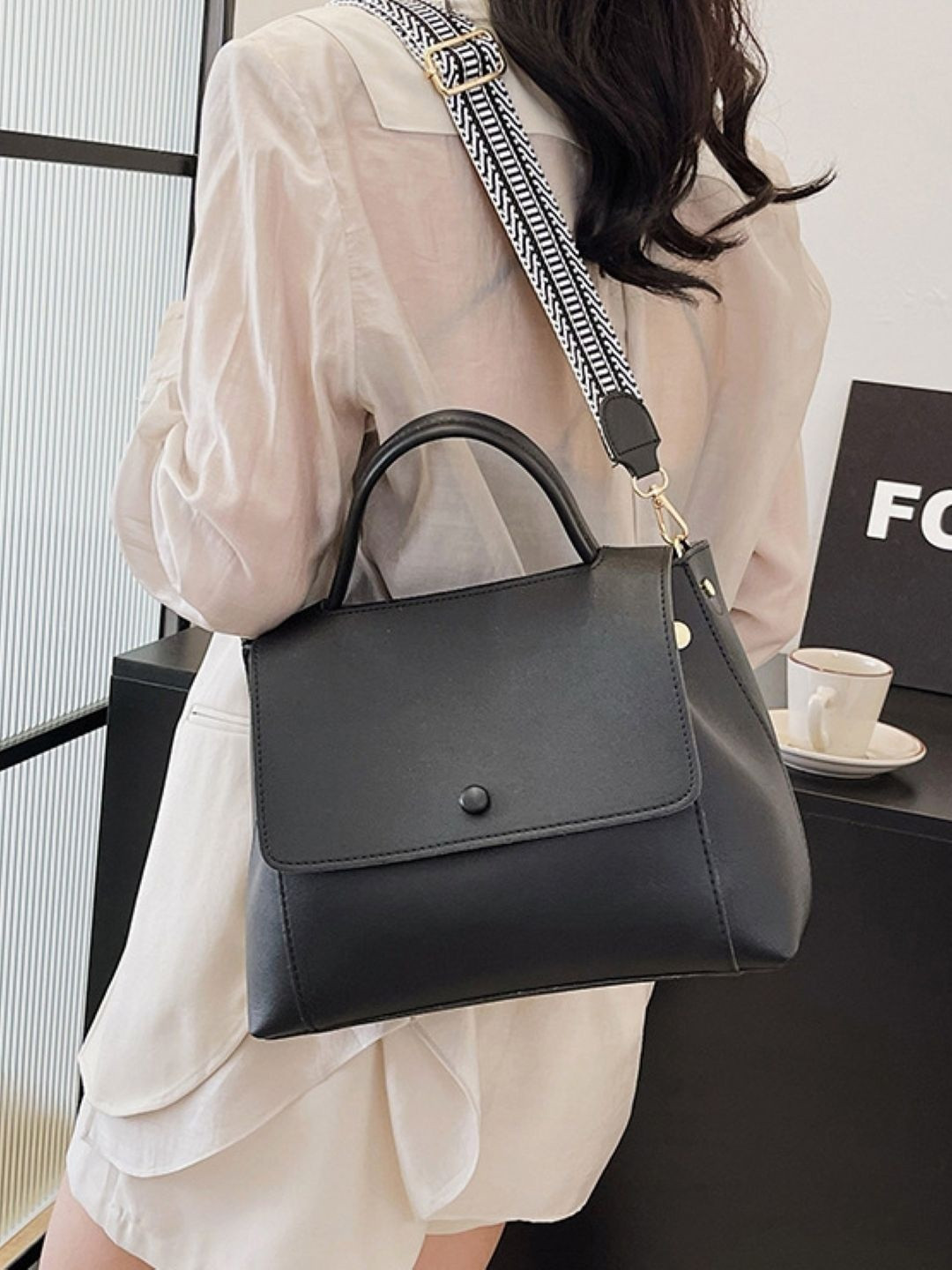 CORSICA Black Solid Casual Handheld Bag