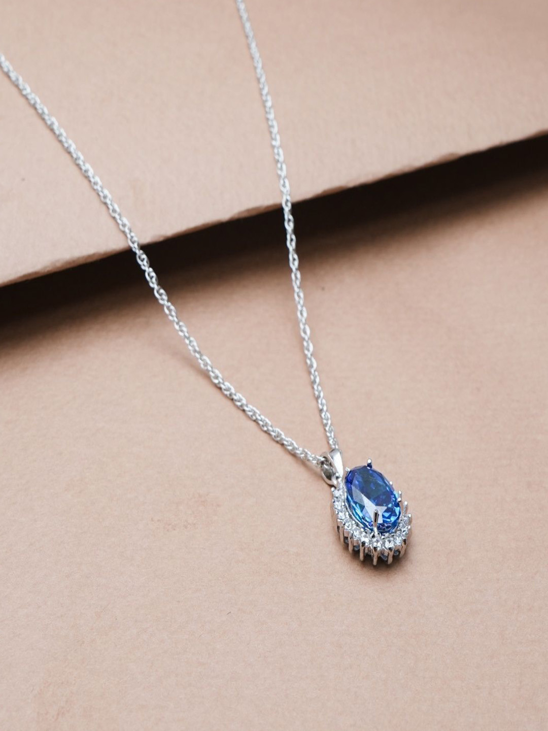 TASSYA Silver Sapphire Studded Oval Shaped Pendant With Chain