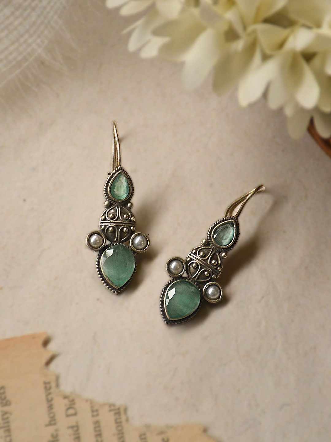 NAMAN ARTS Silver-Plated Artificial Stones Studded Oxidised Teardrop Shaped Drop Earrings