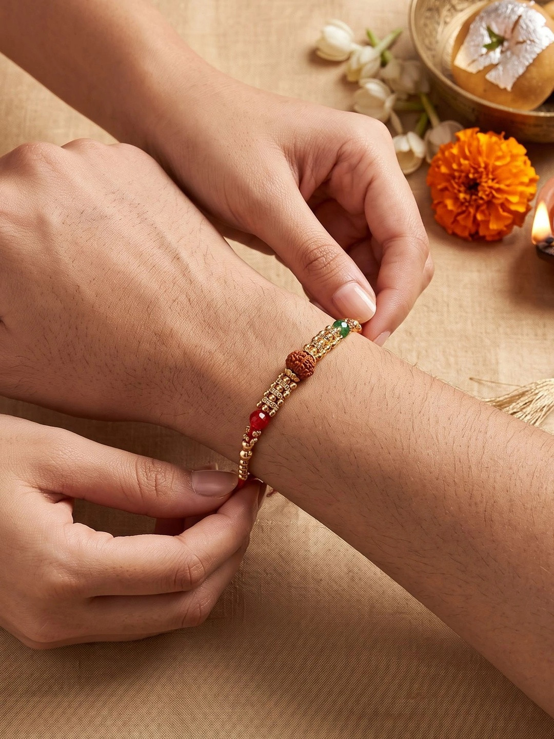 KARATCART Gold Plated Rudraksha Bhaiya Thread Rakhi With Roli Chawal