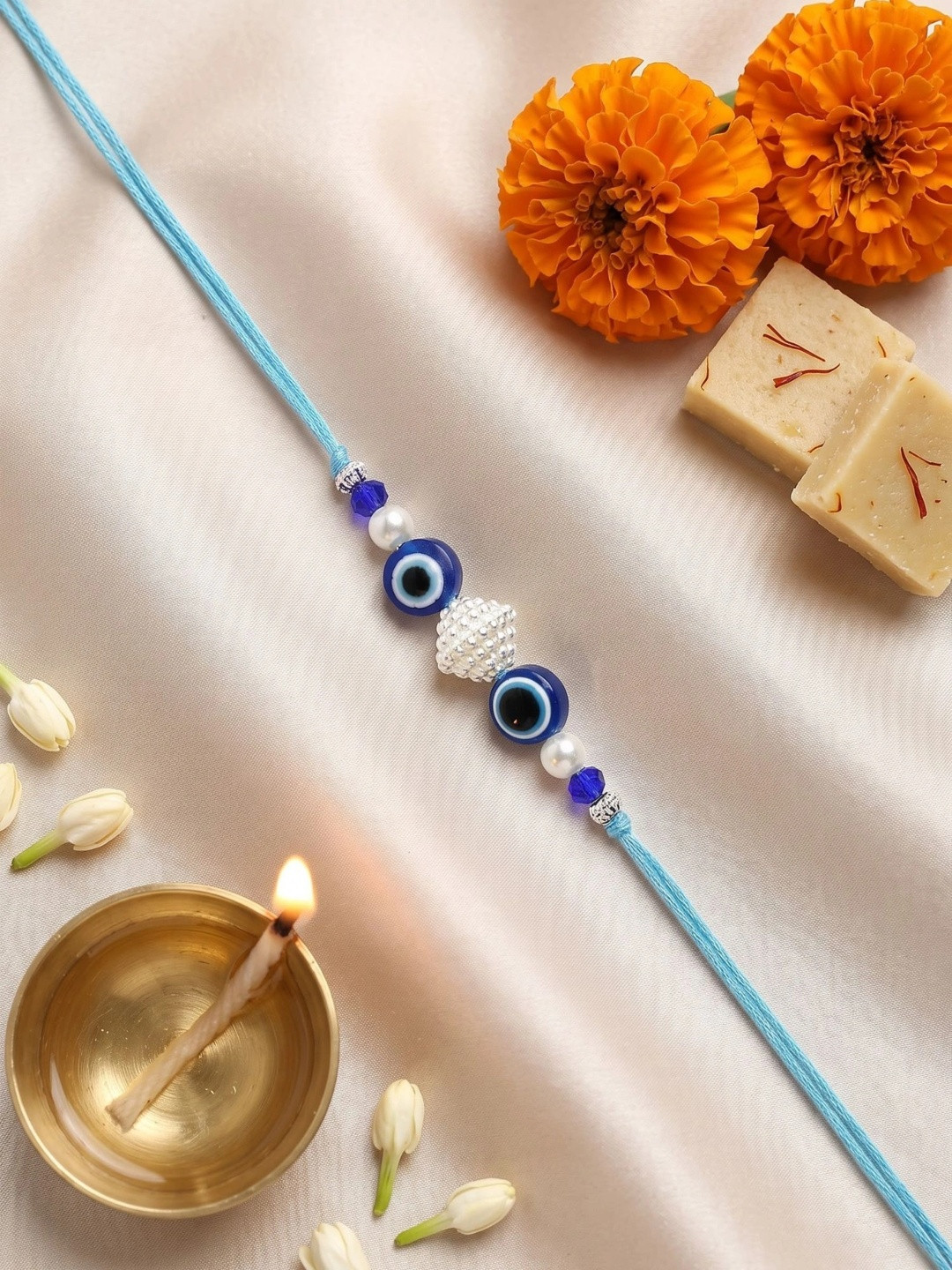 KARATCART Gold Plated Evil Eye Bhaiya Thread Rakhi With Roli Chawal