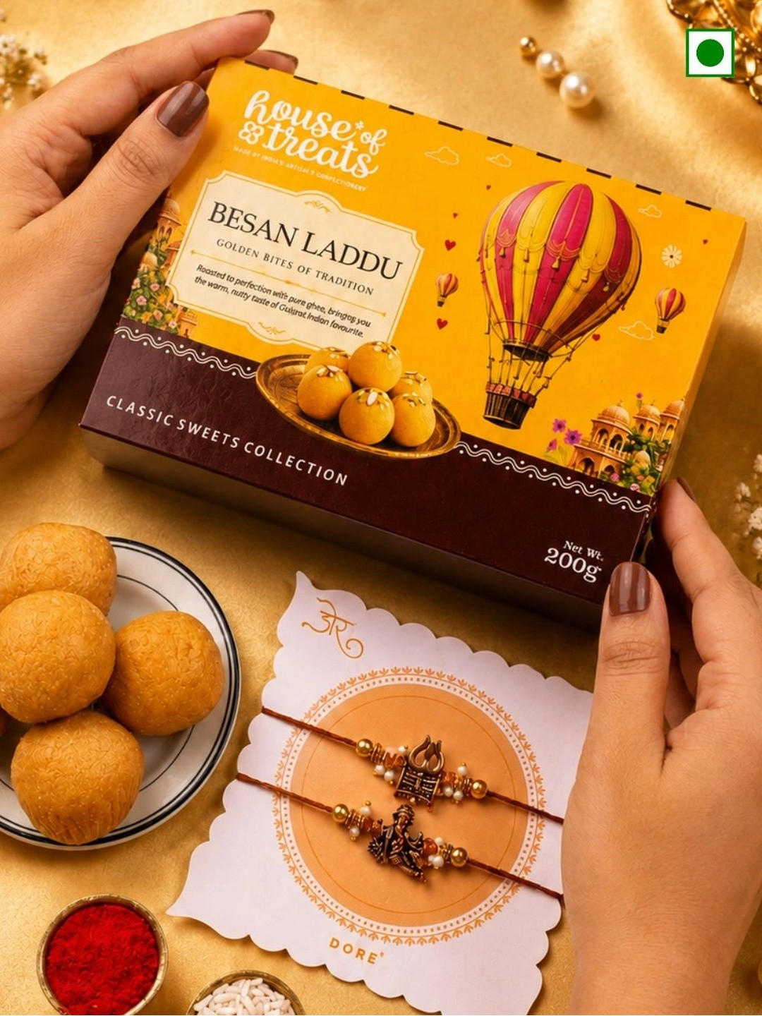 RawFruit Set Of 2 Ganesh & Trishul Charm Rakhi With Besan Laddoo Sweet Gift Set -200g