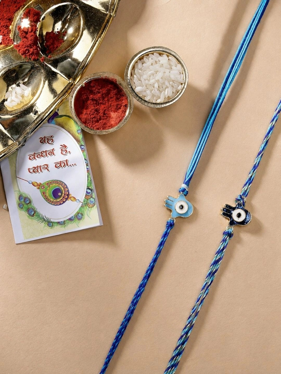 NVR Set Of 2 Evil Eye & Blue Thread Rakhi With Roli Chawal Chandan Mishri