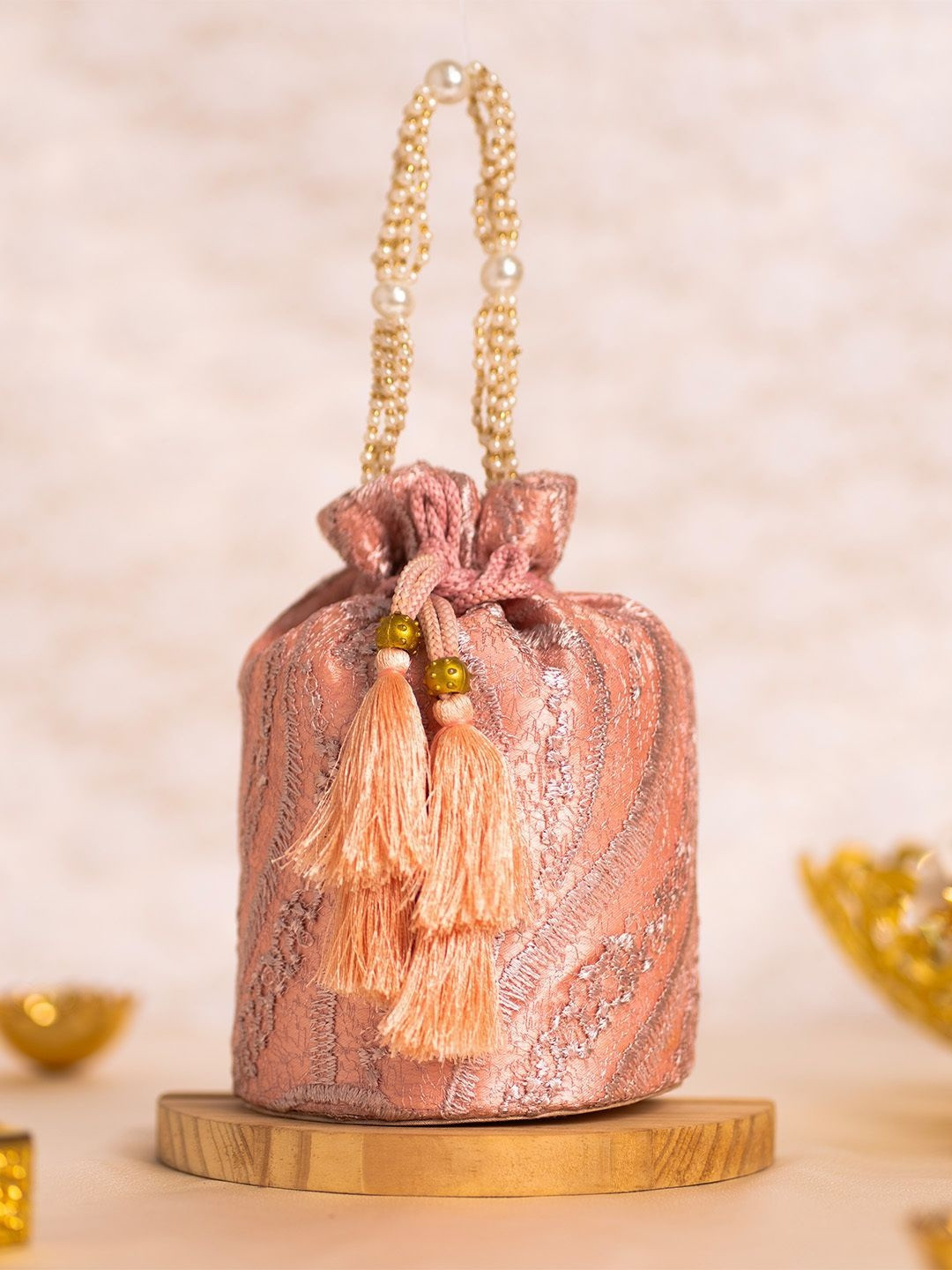Cara Textured Tasselled Potli Clutch