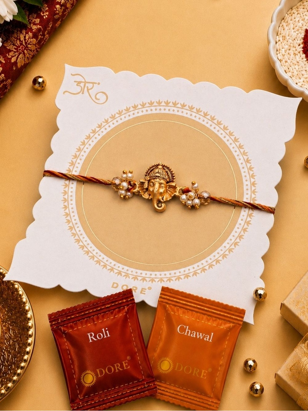 Dore Antique Ganesha Pearl Rakhi with Premium Roli Chawal