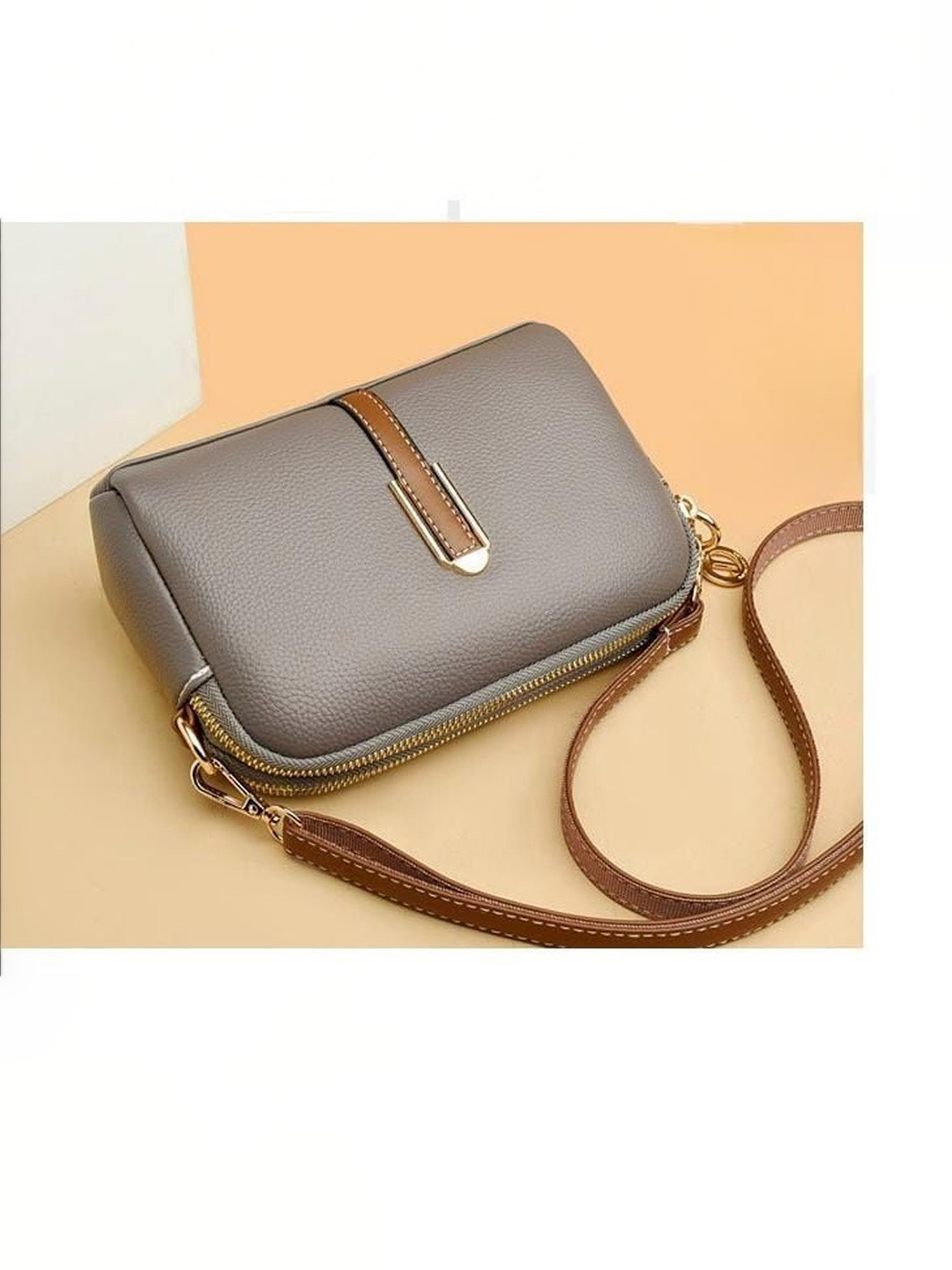 VENITY Textured Sling Bag