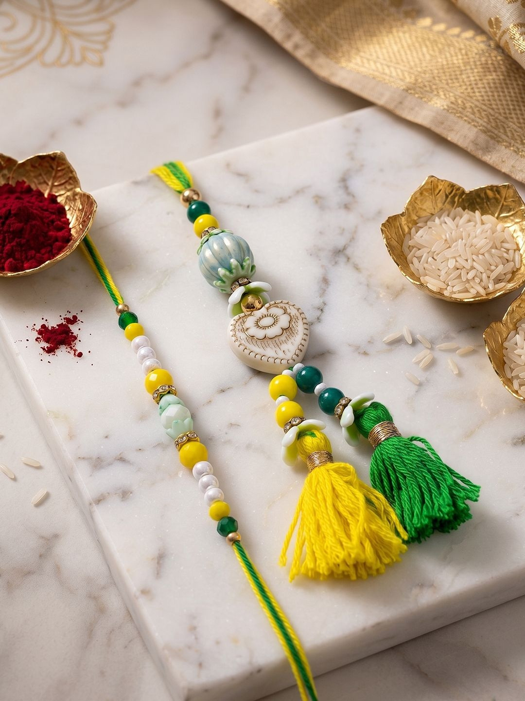 NVR Set Of 2 Green & Yellow Beaded Heart Shape Bhaiya Bhabhi Rakhi With Roli Chawal