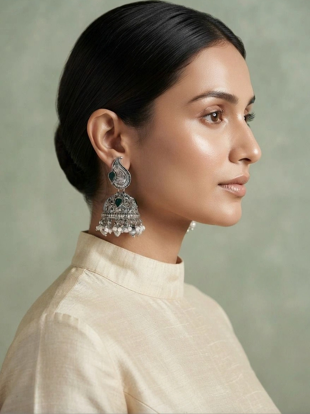 Oxidized Silver-Toned Paisley Motif Green Stone Studded Jhumka Earrings with Pearls