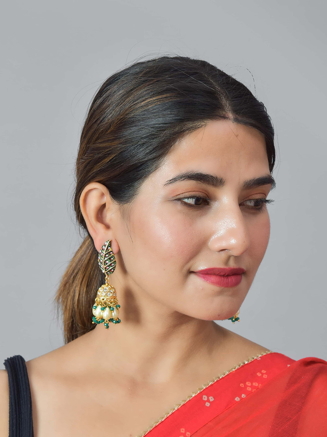 ROHINIKA Gold-Plated Green Leaf Shaped Jhumkas Earrings