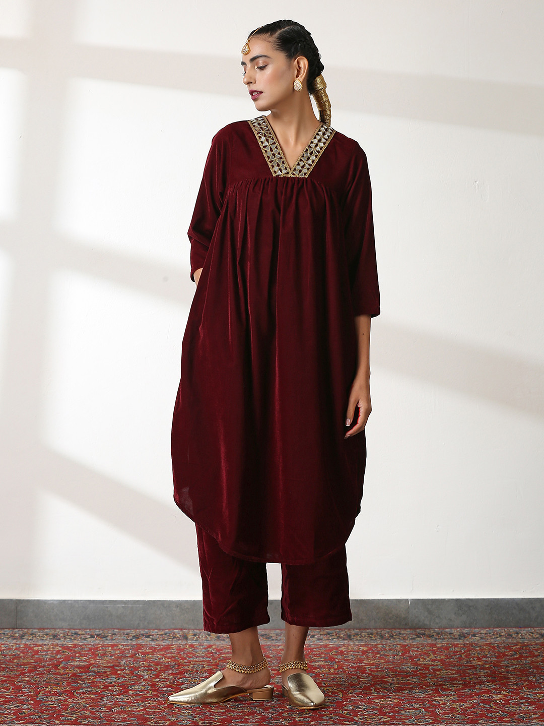 Swtantra Women Burgundy Yoke Design Pleated Mirror Work Velvet Kurta with Trousers